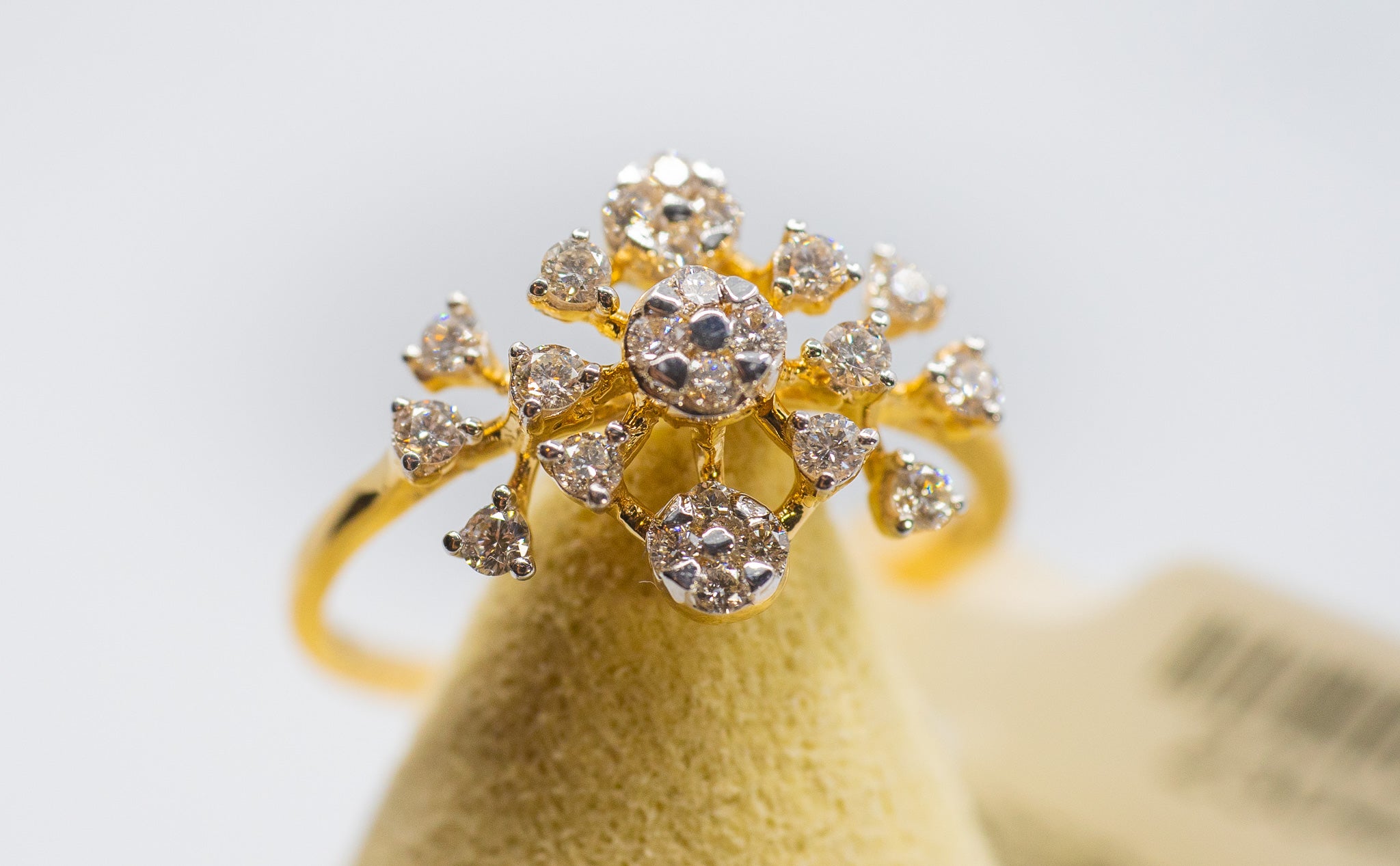 18k yellow gold ring with a floral-inspired diamond cluster design 0.32 carat total weight.