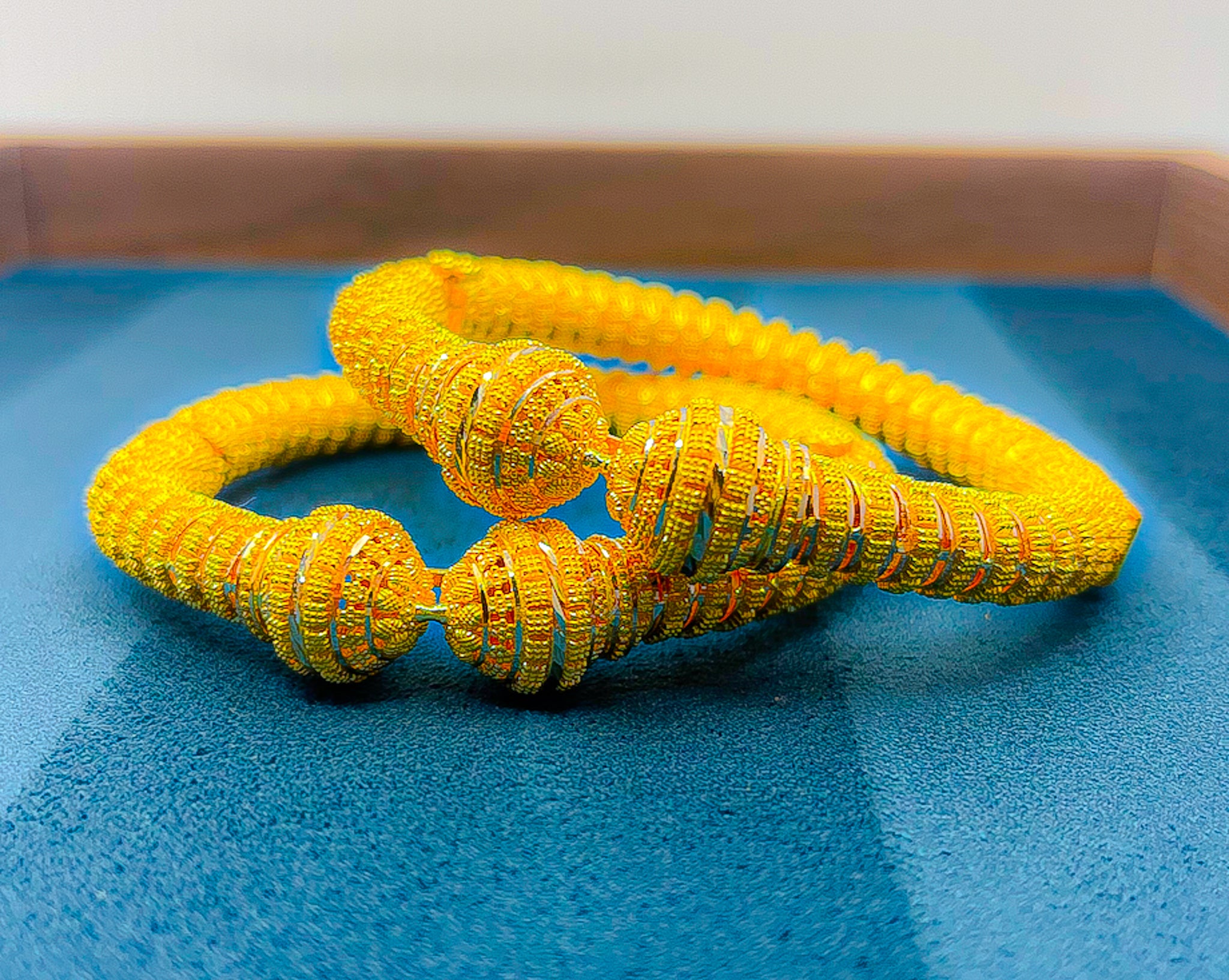 22K yellow gold bangle set (2 PCS) 60.11g with coiled ribbed texture and rounded end caps