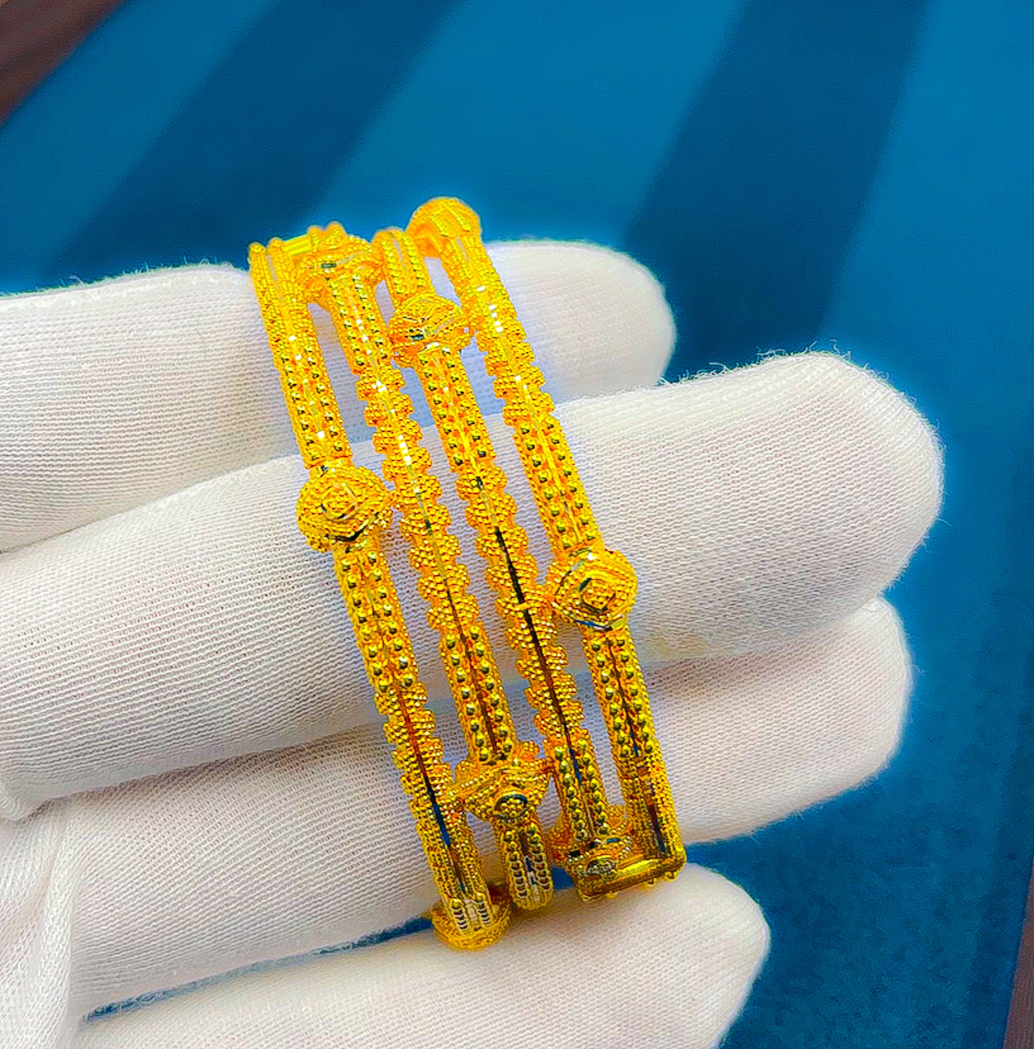 Front view of 22K gold bangle set (2 PCS) showing intricate textured pattern