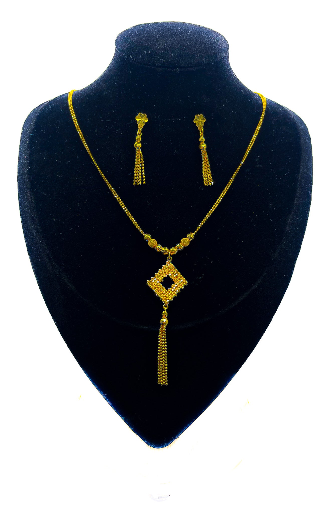 22K yellow gold necklace with matching drop earrings on black velvet mannequin bust