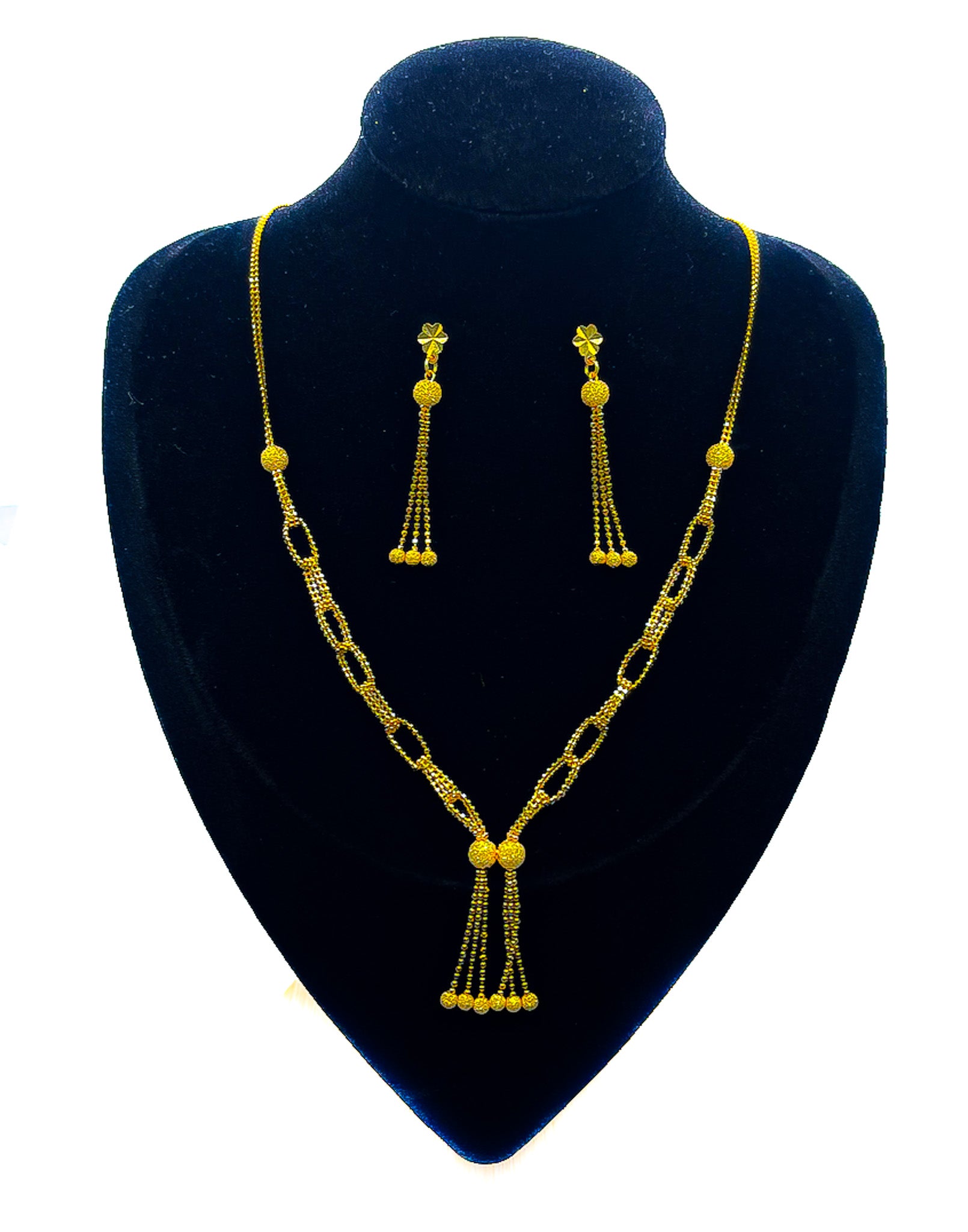 22K yellow gold necklace and matching dangle earrings set 14.64g on black velvet mannequin with white background.