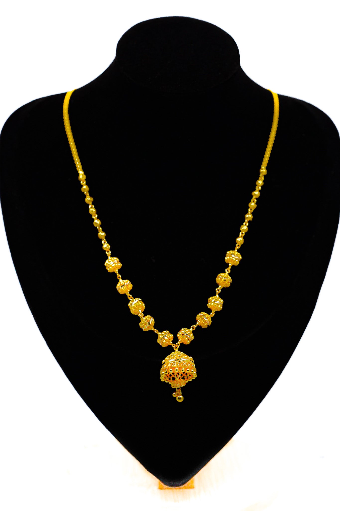 22k yellow gold pendant necklace on a black mannequin bust