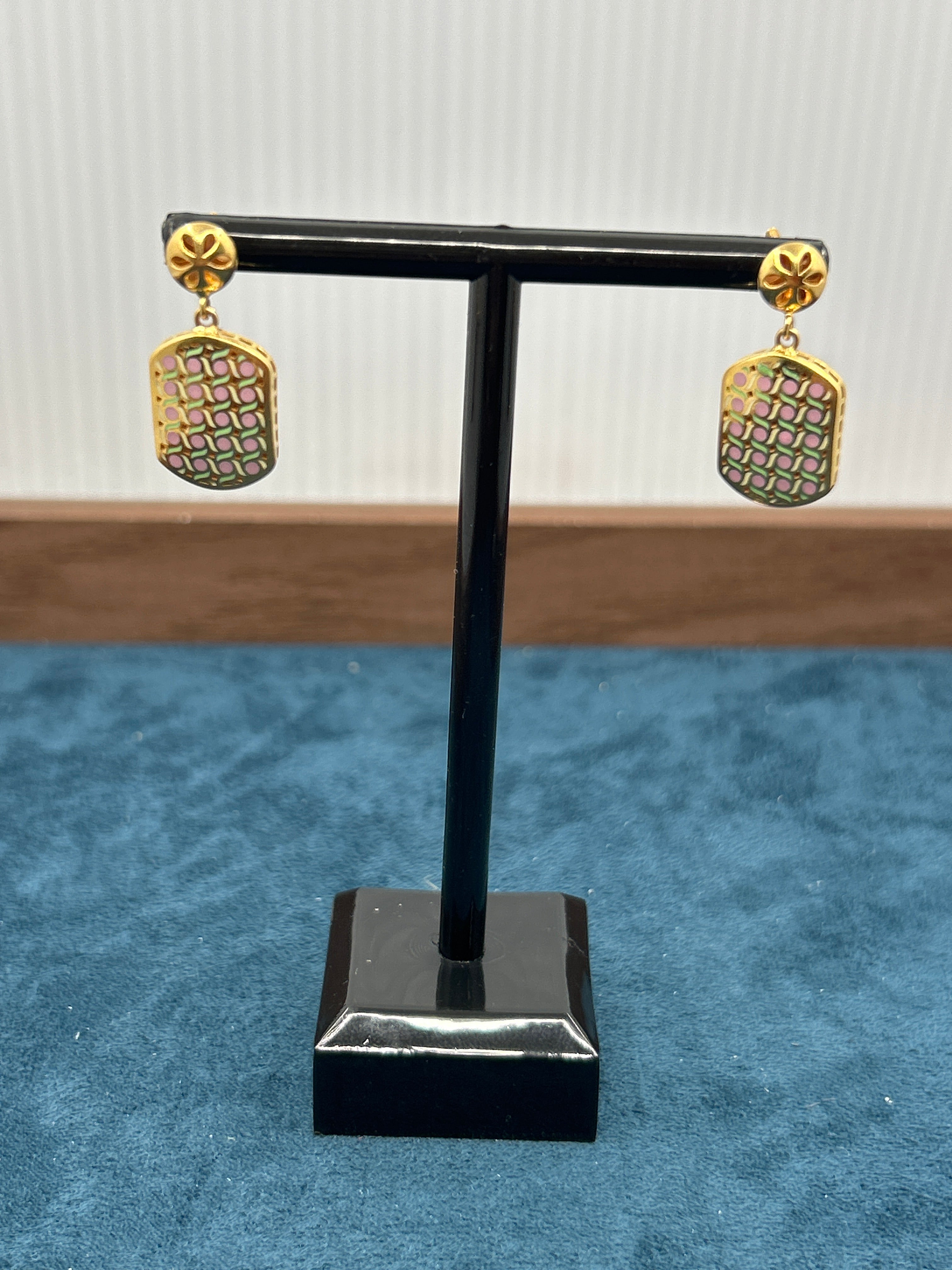 Black and gold decorative item on a textured surface