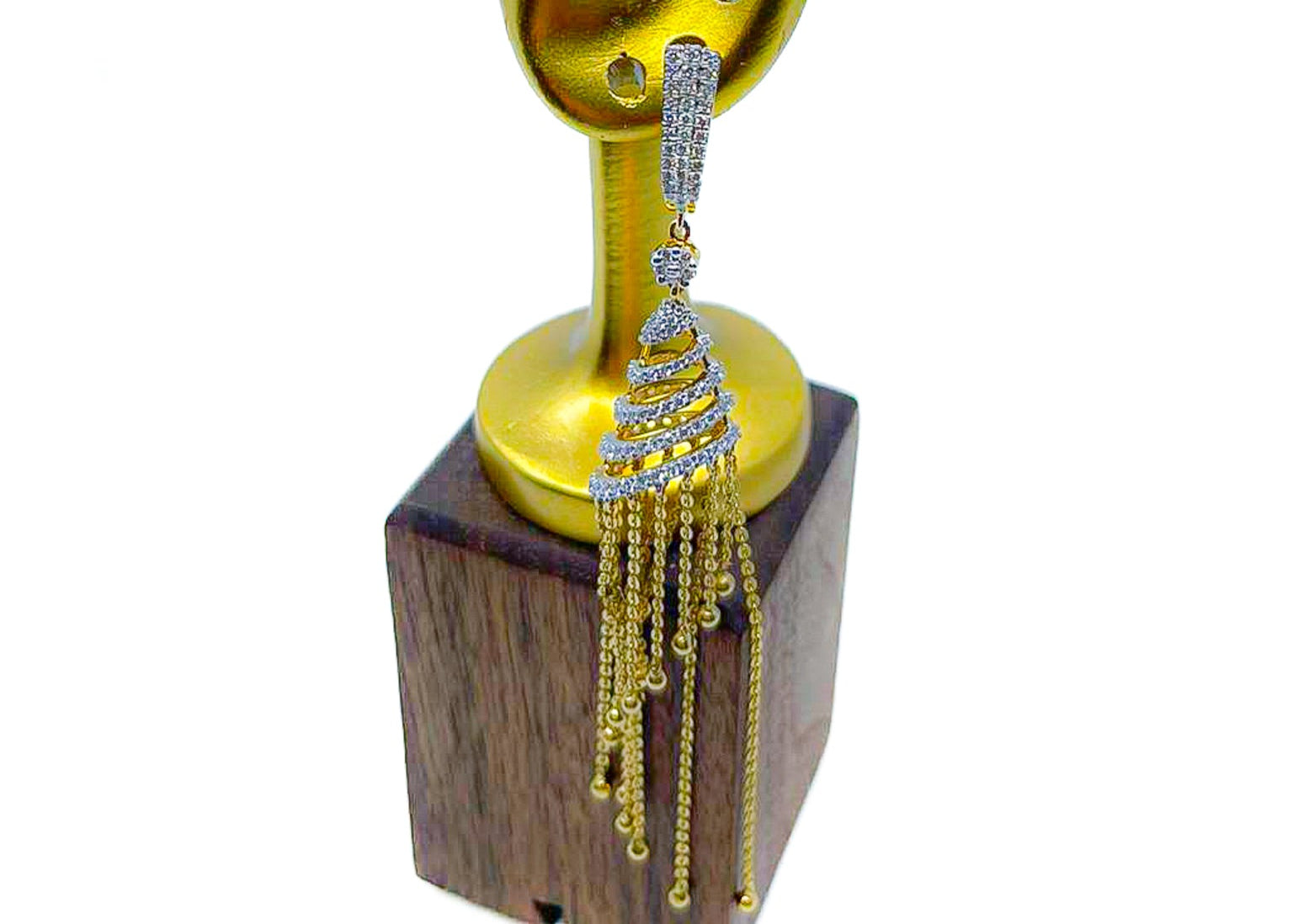 Crystal Bloom diamond drop earring in 18k gold with tassel-style dangle design on a gold stand.