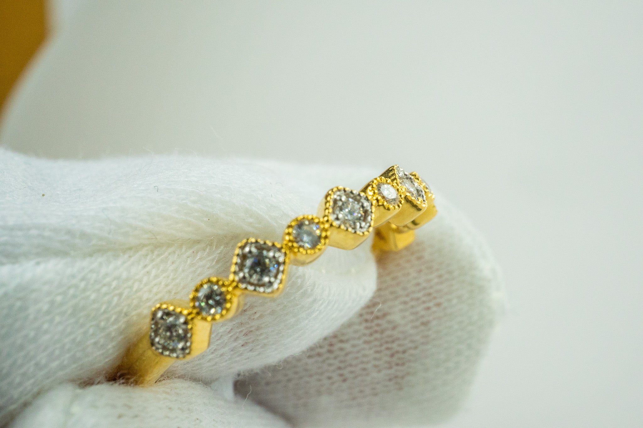 Crystal Kiss ring in 18k gold with diamond station design, 0.16 carat total diamond weight.