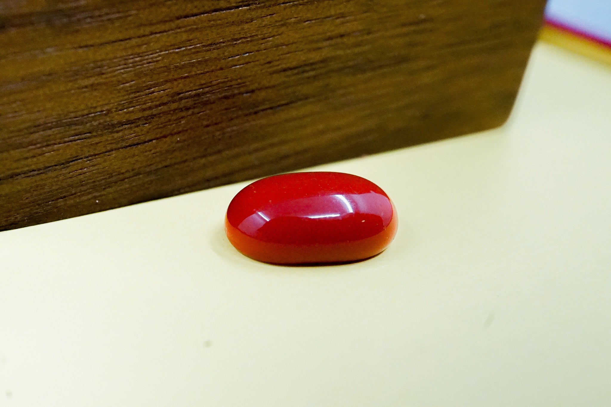 Natural red coral stone 1.34 g oval polished loose gemstone