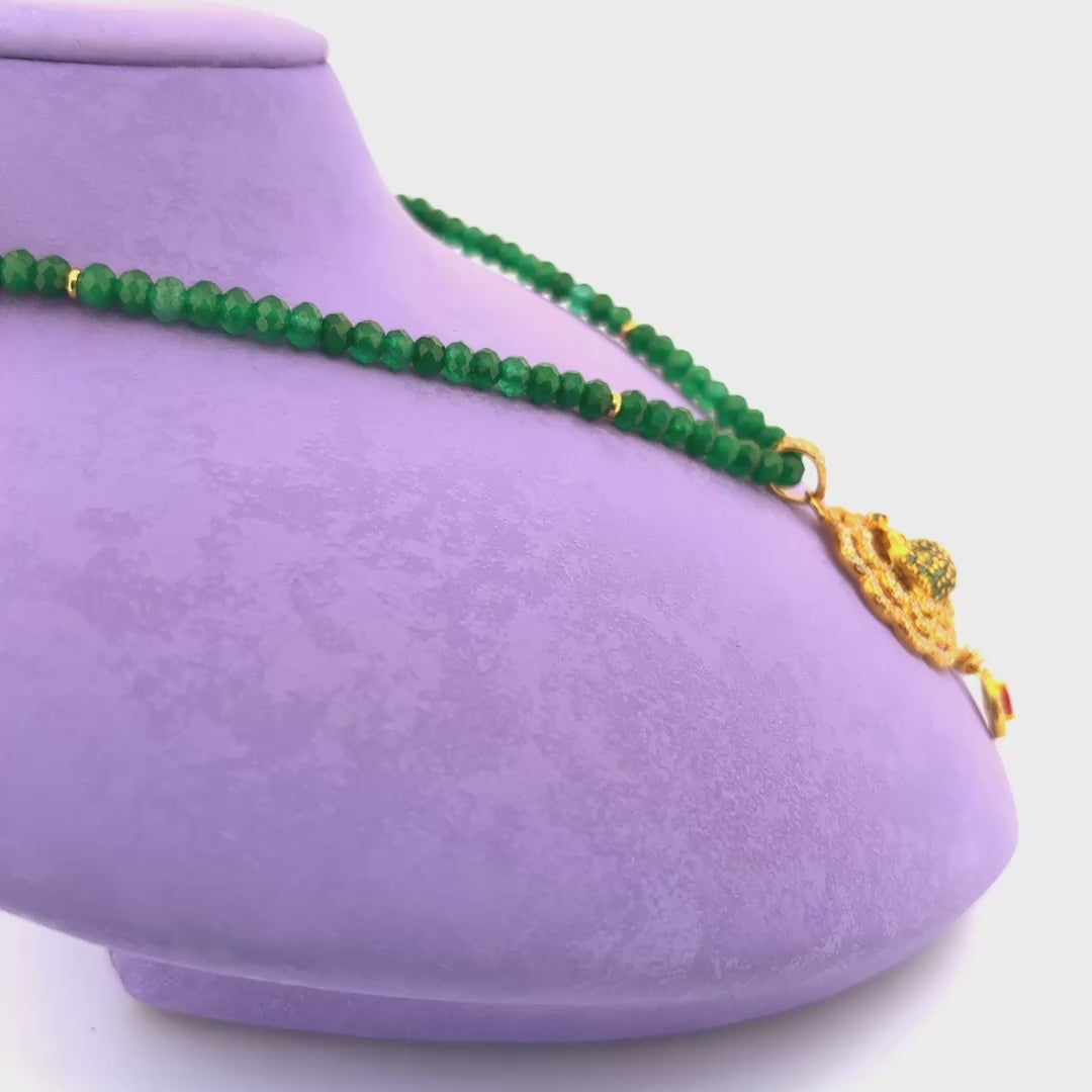 Jade necklace with gold pendant